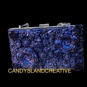 One of a kind resin flower clutch with silver chain.